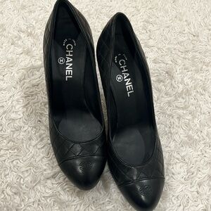 Certified Authentic Chanel Black Leather pumps with proof of authenticity